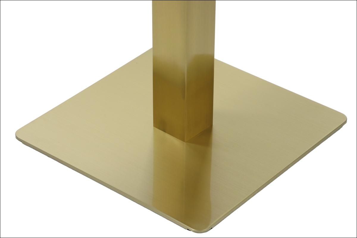 Podstawa do stolika wykonana ze stali nierdzewnej w kolorze złotym.